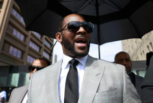 Prosecutors charge 3 with threatening women in R. Kelly case