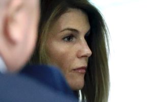 Loughlin, Giannulli plead in college scam but await fate