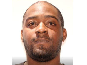 Triple-slaying suspect surrenders after standoff; child safe