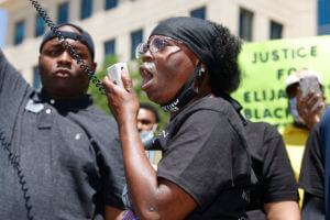 One officer shown in Elijah McClain photos resigns