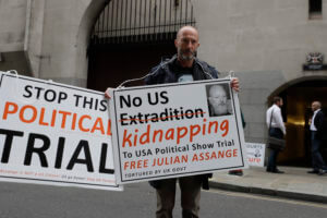 Assange told to stop interrupting witnesses at UK hearing