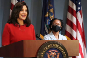 13 charged in plots against Michigan governor, police