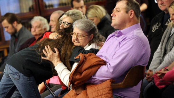 Relative of 8 slaying victims files wrongful death lawsuit