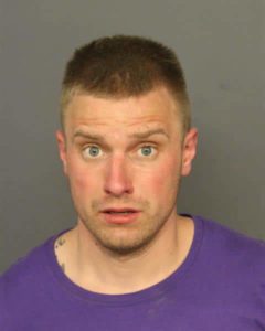 Man charged after human remains found in suitcases in Denver