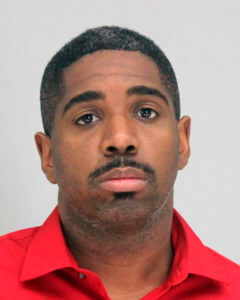 Dallas police officer charged with arranging two killings