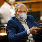 Robert Durst sits wearing a face mask in court
