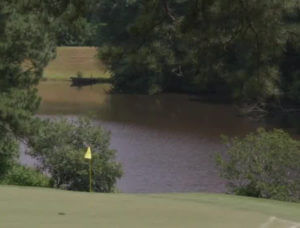 Sheriff: Arrest in slaying of 3 men found at a golf course