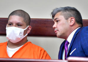 Detective: Suspect’s friends believed he had gun in theater