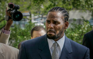 R. Kelly’s manager convicted of gunfire threat at theater