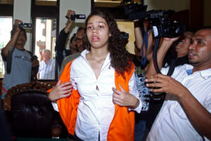 Woman charged in suitcase murder case to remain locked up