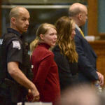 Lynlee Renick is led out of court in handcuffs