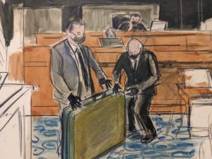 Evidence at Maxwell trial: massage table, unfolded in court