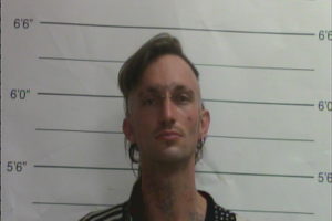 Man arrested after body found in freezer in New Orleans