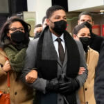 Jussie Smollett walks outside of court
