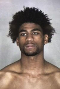 Naked man arrested after opening fire on bus, killing 1