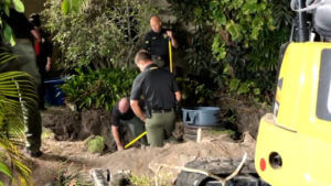 Authorities say woman may have been buried alive in septic tank
