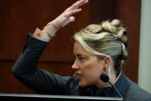 Jury sees pics of Heard’s swollen face after fight with Depp