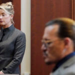 Actors Amber Heard and Johnny Depp watch as the jury leave the courtroom
