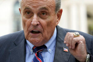 Heckler charged with assault after confronting Rudy Giuliani