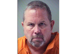 Officials: Florida fire chief is arrested on murder charge