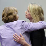 Amber Heard hugs her lawyer Elaine Bredehoft after the verdict