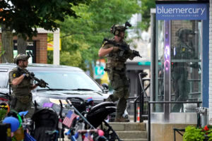 Disguised as a woman, gunman fired more than 70 rounds at July 4 parade