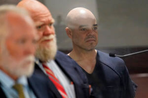 Hearing reset for official jailed in Vegas reporter slaying