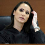 Judge Elizabeth Scherer sits on the bench