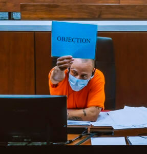 Man charged in parade killings removes shirt before openings