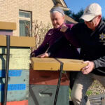 Officers in Mass. load containers of bees after a woman unleashed a swarm onto deputies serving her an eviction notice.