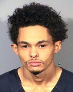 Prosecutor: Man held in Vegas officer killing fired 18 shots
