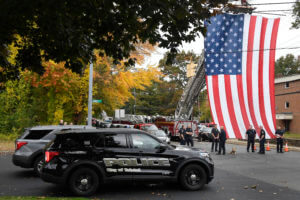 Medical examiner: 2 officers died from multiple gunshots