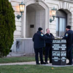 Officers stand outside of the Carroll County Courthouse