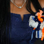 A close up of ribbons worn on a woman's chest