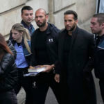 Andrew Tate and his brother Tristan are brought by police officers to the Court of Appeal, in Bucharest, Romania