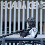 Security personnel guard the prosecutor's building where Ovidio Guzmán is in custody