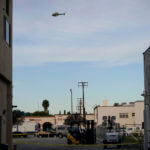 A law enforcement helicopter hovers over Star Dance Studio