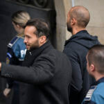 Andrew Tate and his brother Tristan are brought by police officers to the Court of Appeal, in Bucharest, Romania