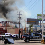 The police arrives on the scene after a store was looted in Culiacan