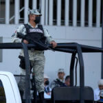 Security personnel guard the prosecutor's building where Ovidio Guzmán is in custody