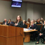 Innocence Project attorney Susan Freidman talks at the podium from the Albert "Ian" Schweitzer court case