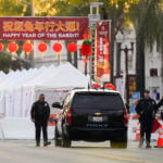 Police officers stand outside a ballroom dance club in Monterey Park