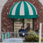 Investigators are seen outside Star Dance Studio in Monterey Park, Calif., Sunday, Jan. 22, 2023