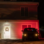A private security officer sits in a vehicle, Tuesday, Jan. 3, 2023, in front of the house in Moscow, Idaho where four University of Idaho students were killed