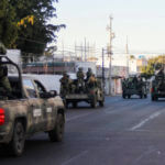 An army convoy patrols the streets of Culiacan