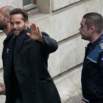 Andrew Tate and his brother Tristan are brought by police officers to the Court of Appeal, in Bucharest, Romania