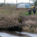 A police diving team works at the River Wyre as they continue their search for missing woman Nicola Bulley