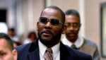 R. Kelly, center, leaves the Daley Center after a hearing in his child support case May 8, 2019