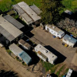 a cluster of mobile homes is seen at the California Terra Garden, formerly Mountain Mushroom Farm