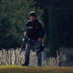 Manhunt for suspect accused of shooting 2 Maryland police officers